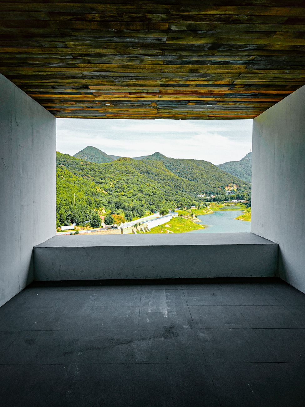 Travel writer documenting reflections in a modern minimalist villa