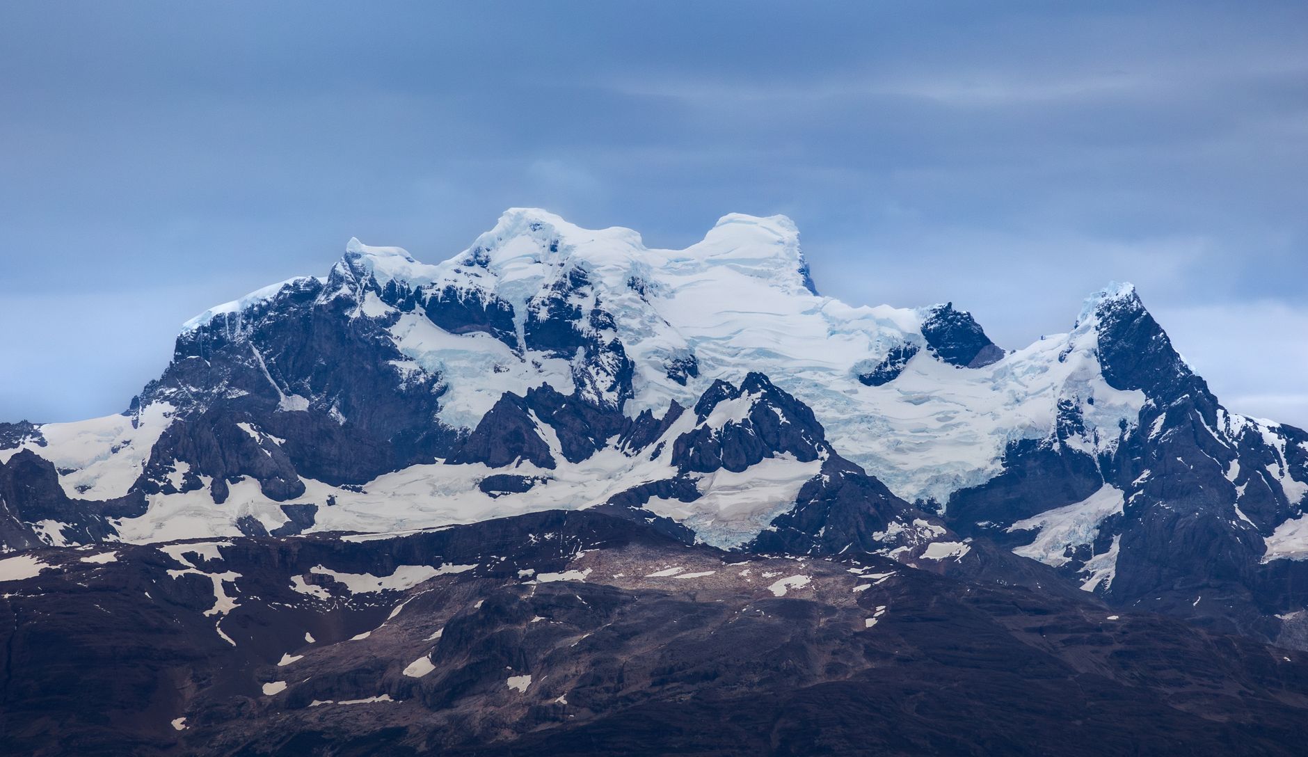 Patagonian landscape with dramatic peaks and turquoise glacial lake